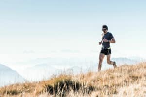 man trail running on the mountain