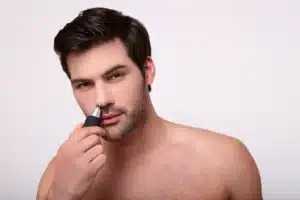 man trimming nose hair