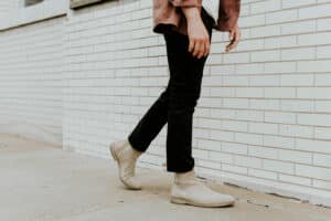 man wearing suede chelsea boots