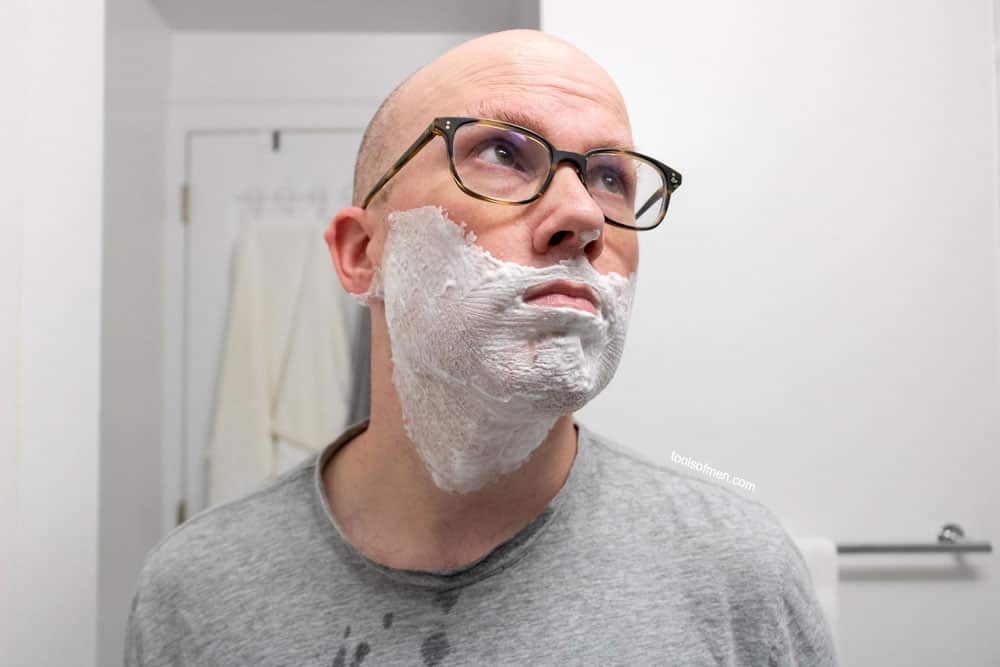 man with a dry shaving cream on face