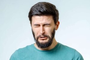man with beard crying