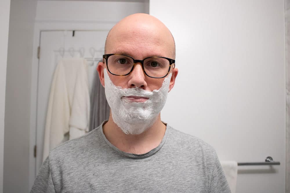 man with body shop shaving cream applied to face