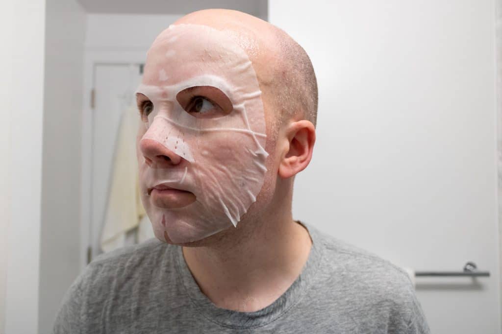 man with cardon face mask on