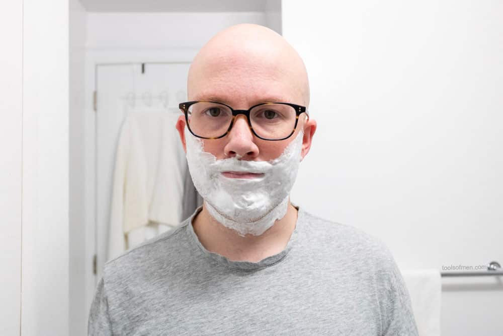 man with shaving cream on face