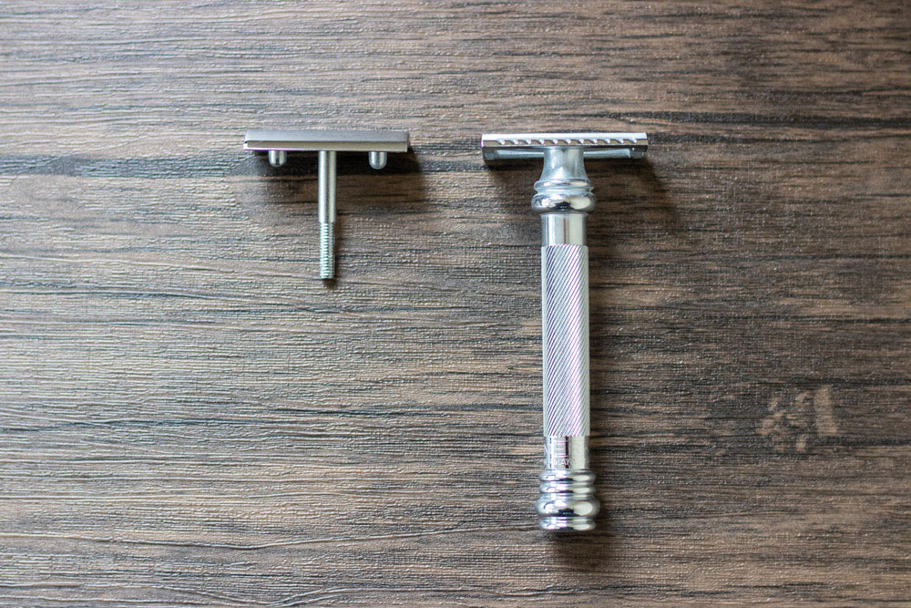 merkur 38c disassembled on a brown table