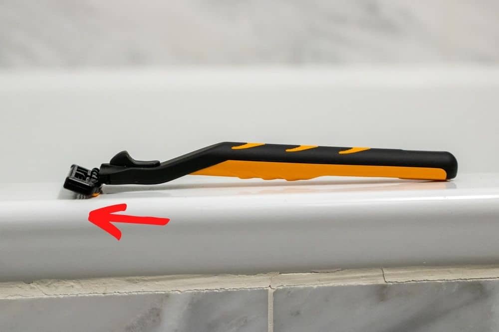 microtouch tough blade on bathtub ledge demonstrating thin design