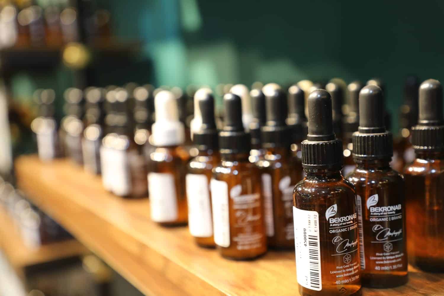 several bottles of beard oil on a shelf