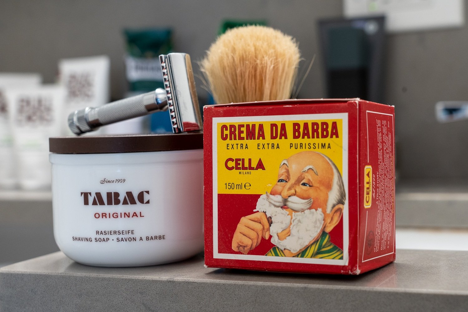 tabac and cella shaving soaps on a bathroom countertop