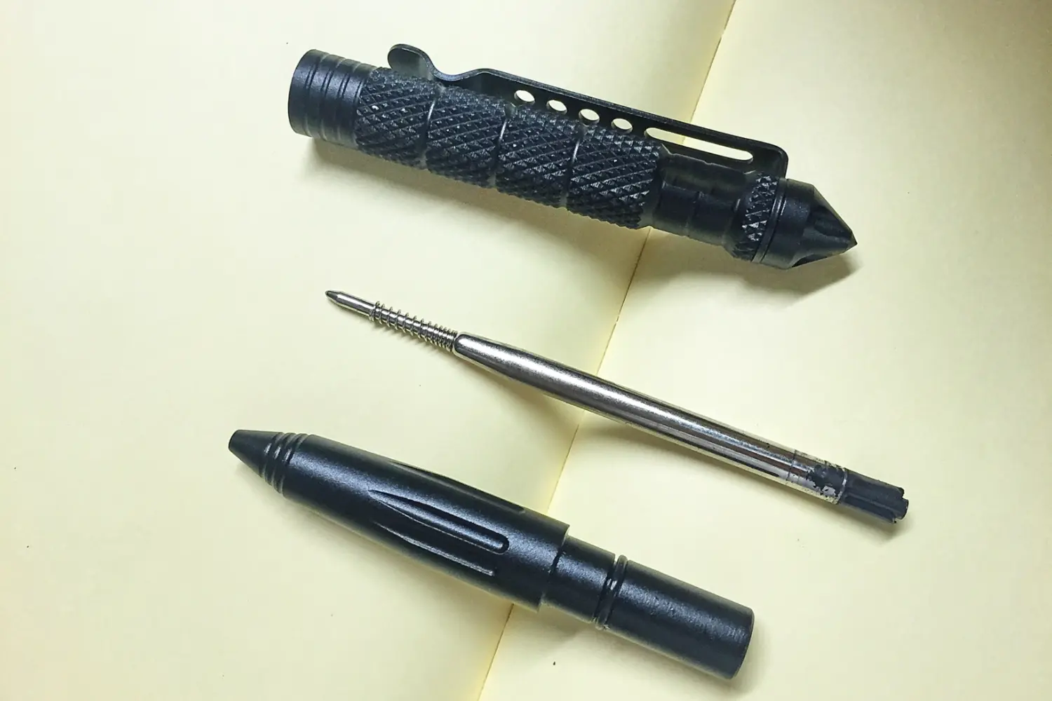 tactical pen on a notebook