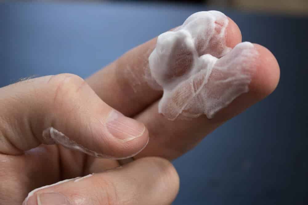 two fingers with shave cream