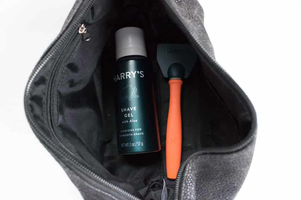 view of harrys razor and shave gel in dopp kit