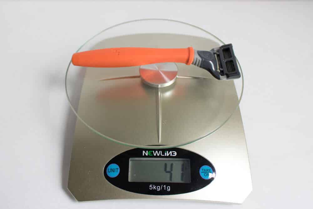 weighing harrys razor on a scale