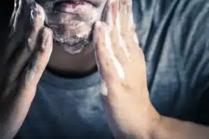 closeup of man washing chin