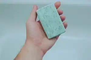 man holding a bar of soap