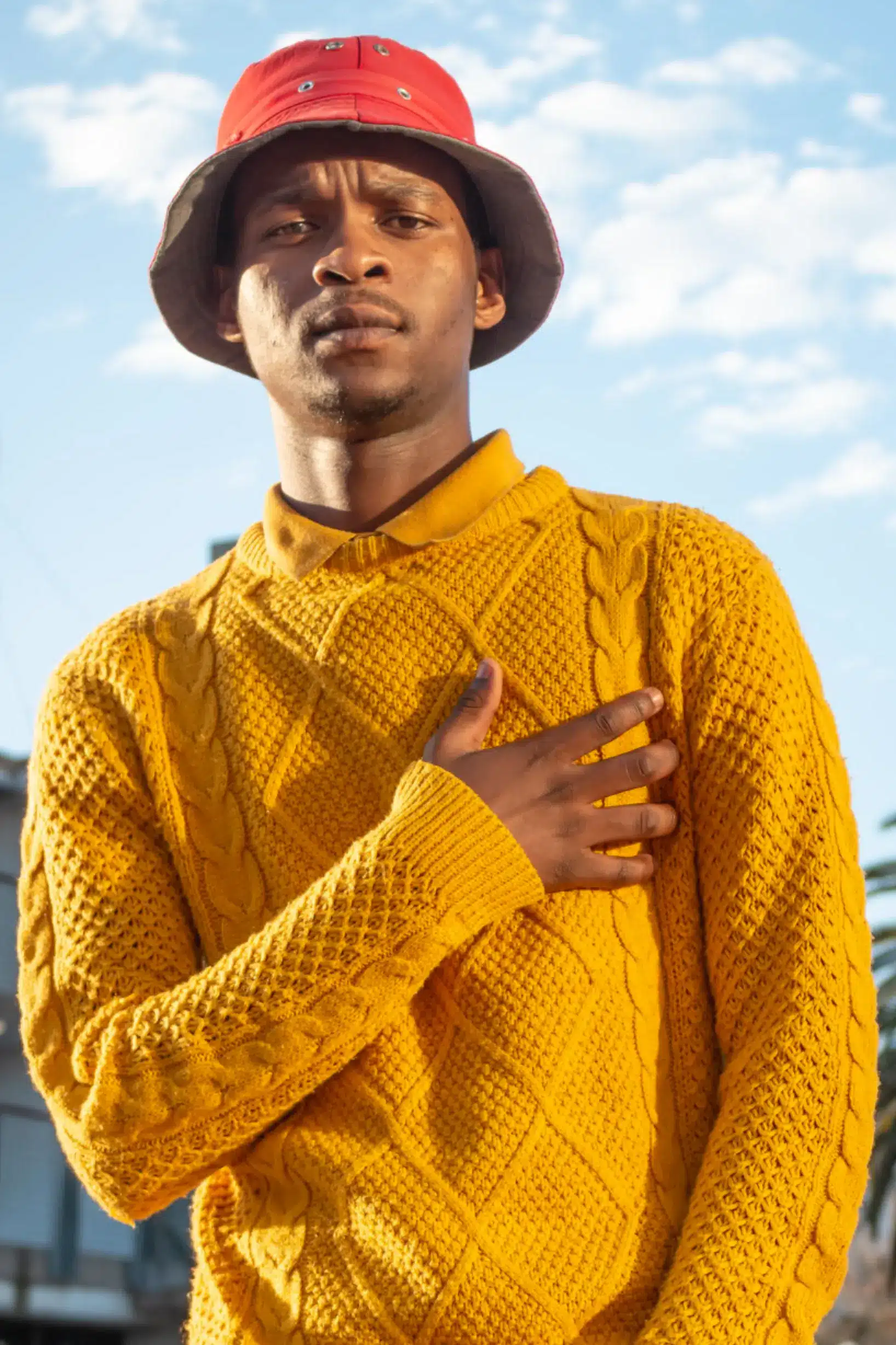 man with sweater and bucket hat on